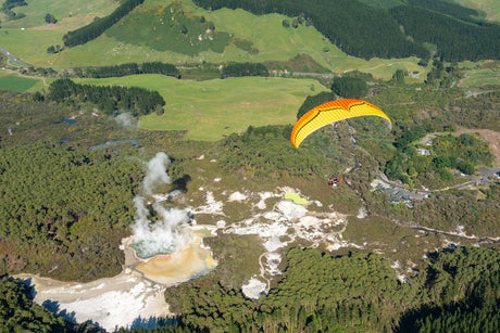 two people flying The Roadster 3 over hills