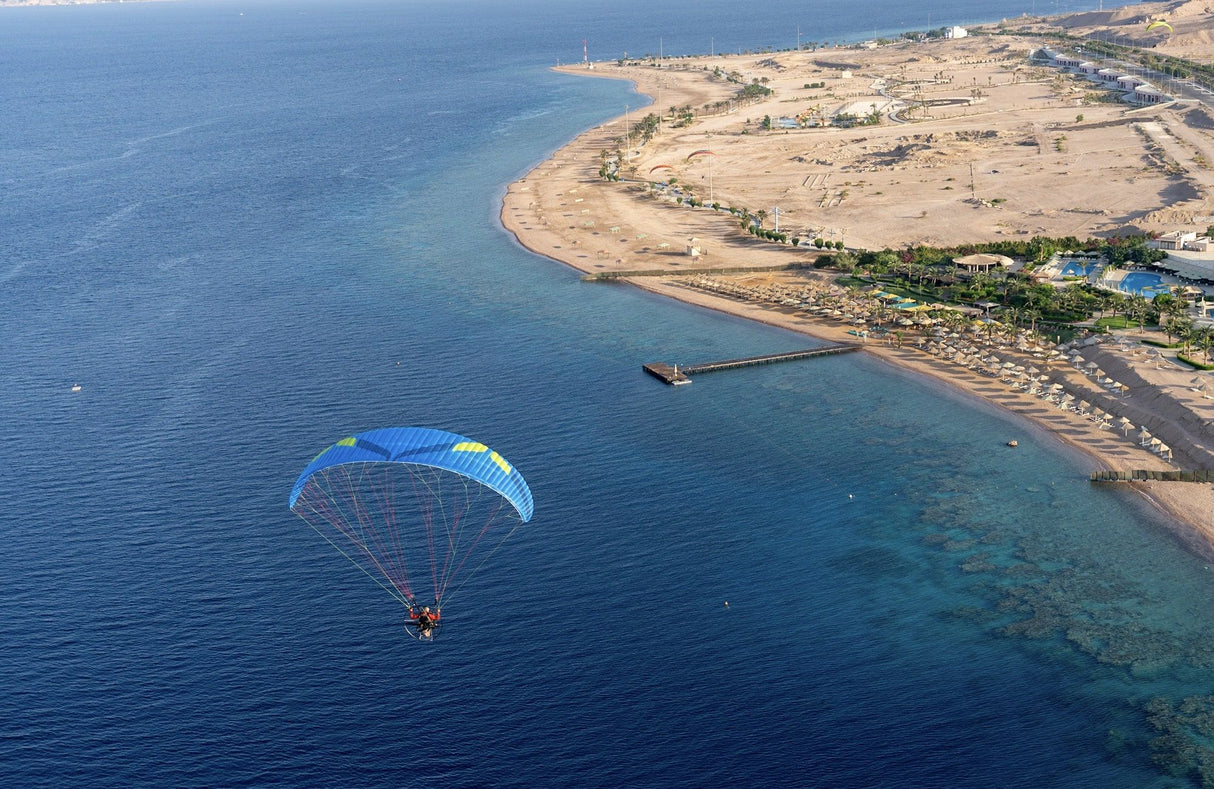 paramotoring over the sea by the coast