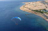 paramotoring over the sea by the coast