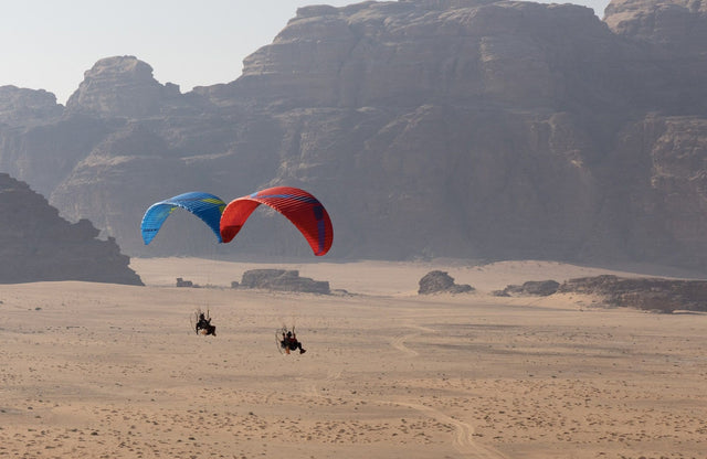 two paramotors side by side in desert