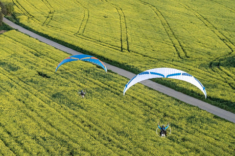 two people flying paramotor with Viper 62 wing over wheat fields