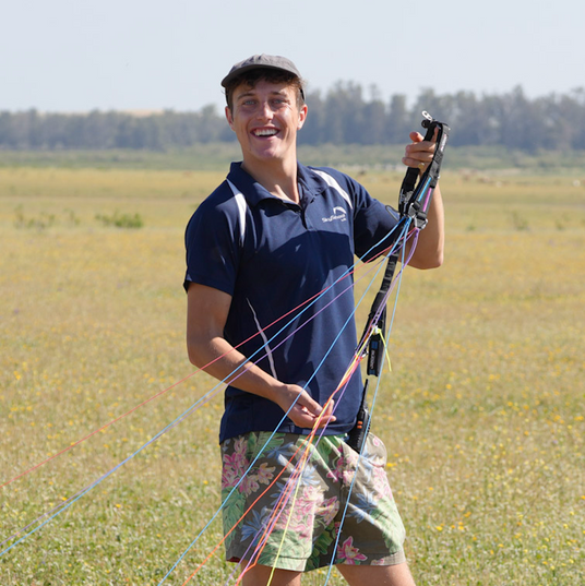 man with paramotor strings